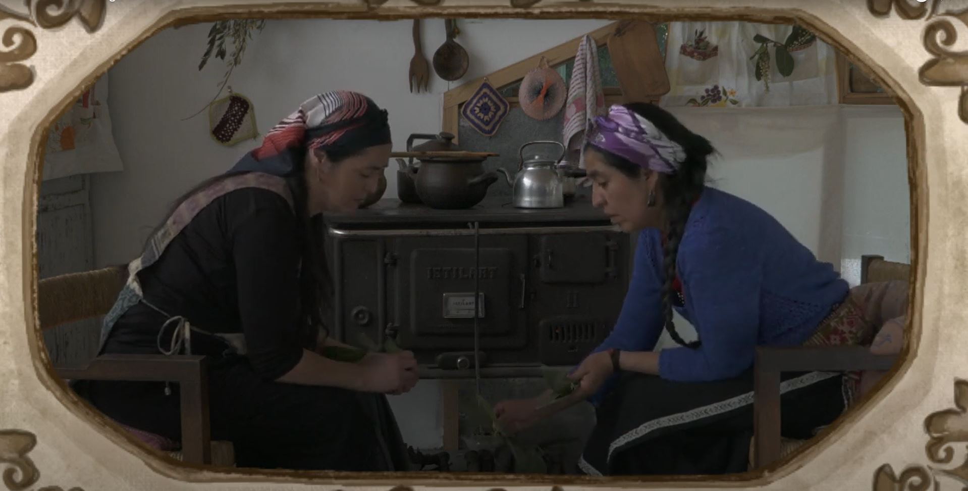 Two Mapuche women in the kitchen of a rural home, preparing an herbal remedy.