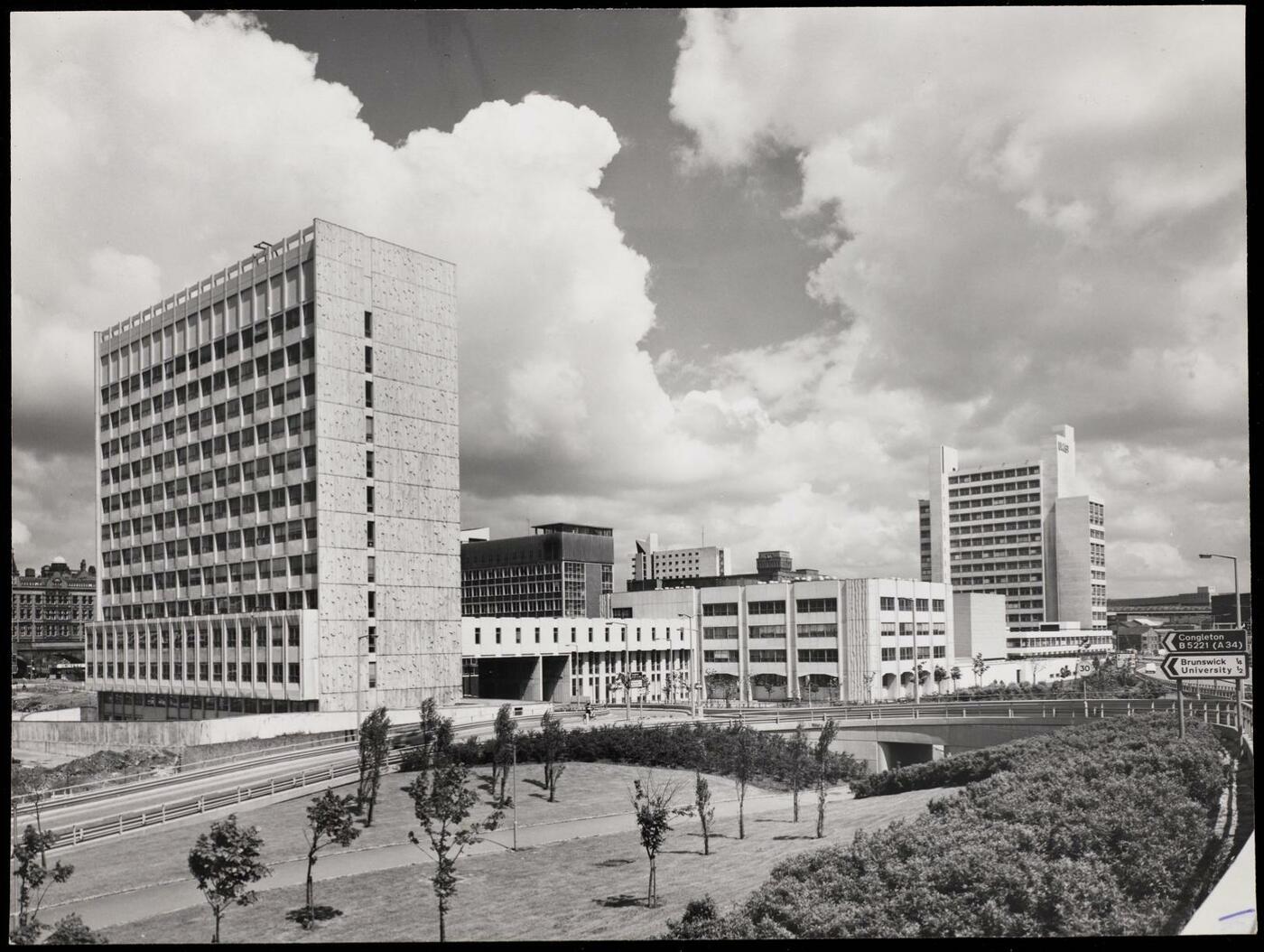 Elevated view of the new buildings of the UMIST campus, with a landscaped area in the foreground. 