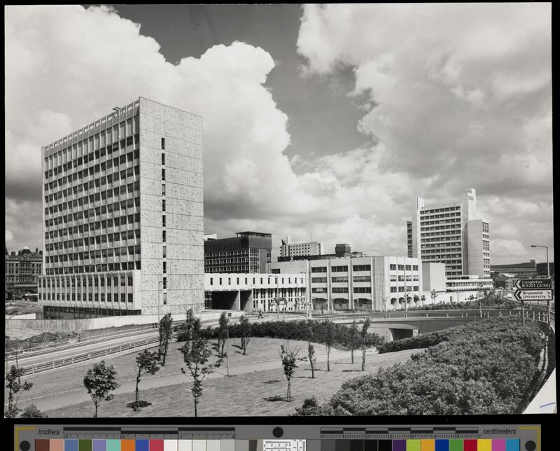 Elevated view of the new buildings of the UMIST campus, with a landscaped area in the foreground. 