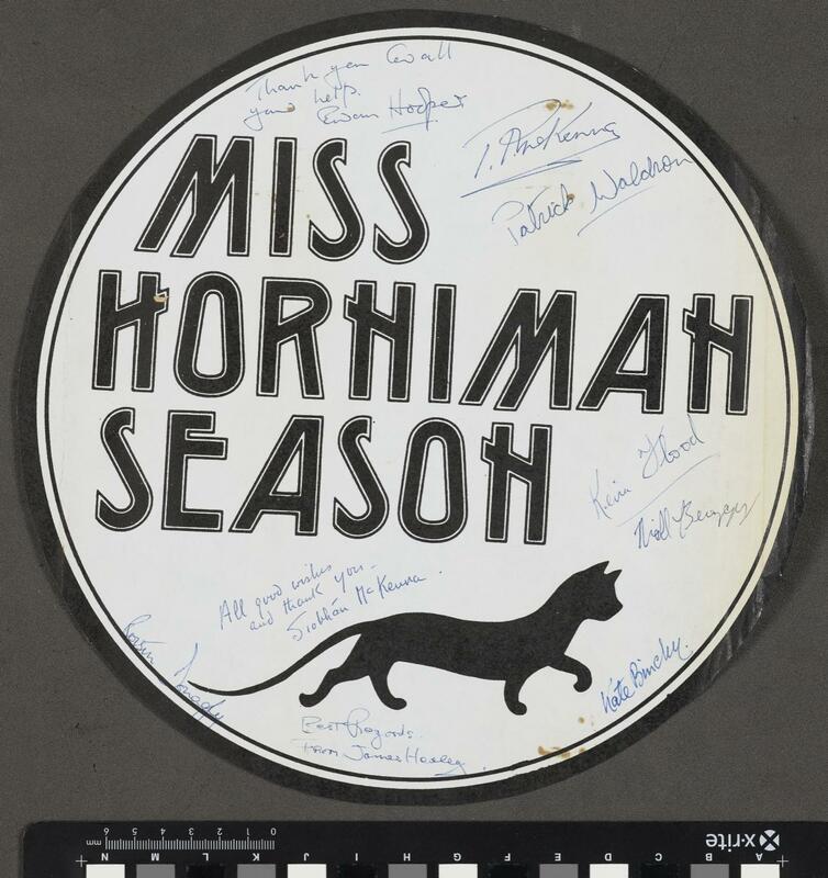 Paper plaque used to advertise the Horniman Festival. Signed by various members of the cast of The Golden Cradle. Text reads 'Miss Horniman Season' and also depicts a drawing of a black cat.